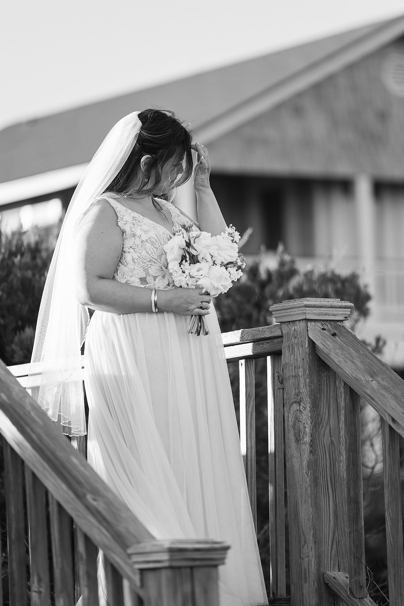 A bride walks down the boardwalk to her wrightsville beach wedding and elopement